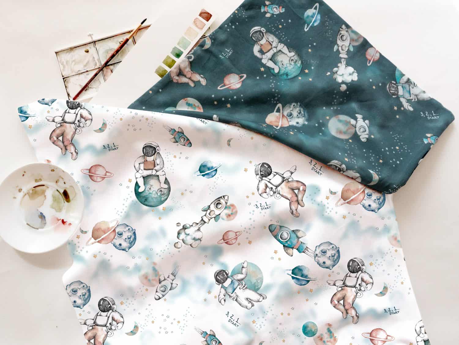 Diseño de estampados textiles con astronautas y planetas.