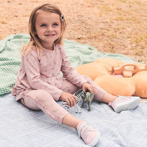 small flower print clothes small girl model on the beach