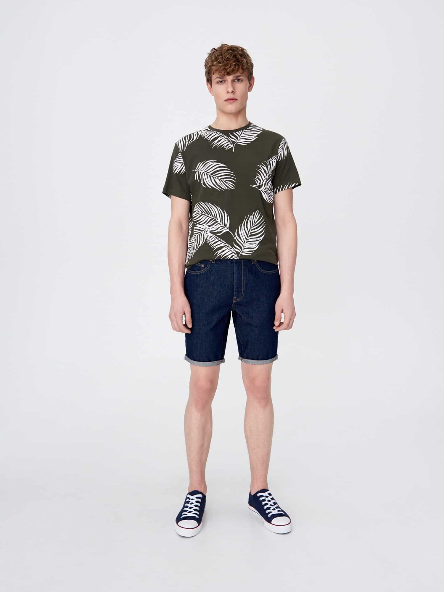 model men standing in shorts and palm leaves t-shirt 