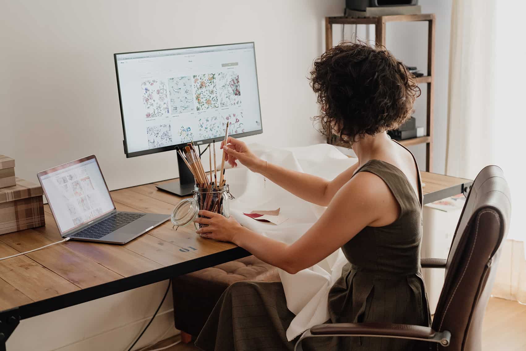 woman making a pattern design at her studio