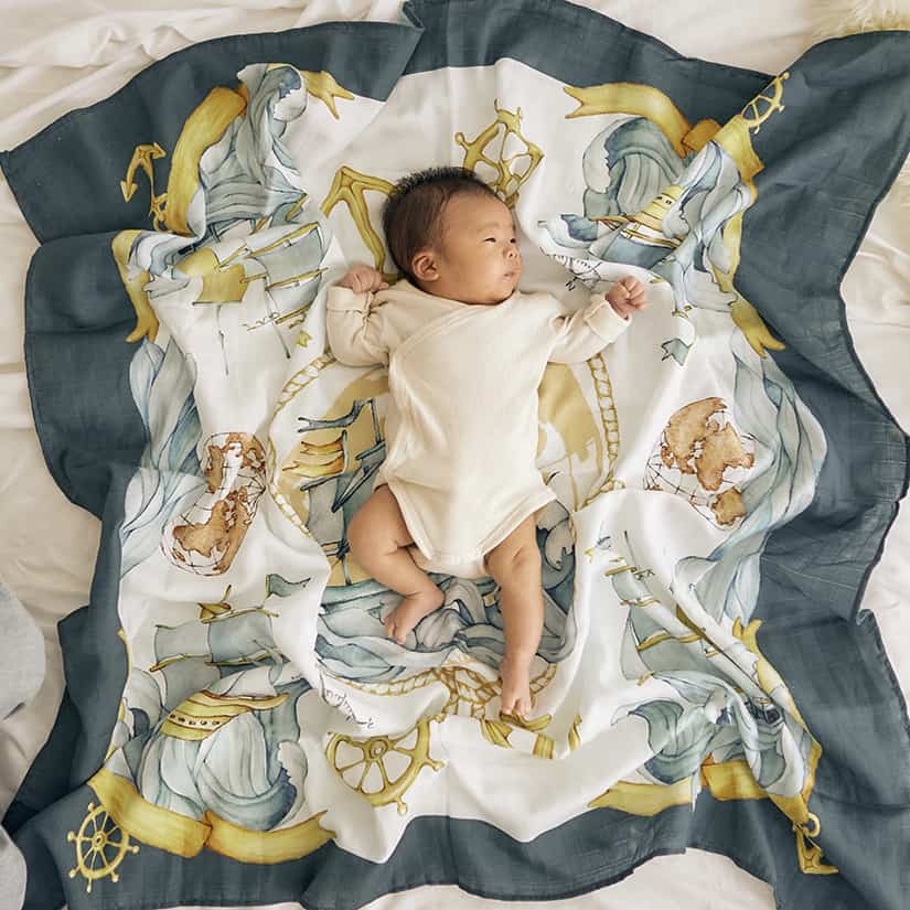 baby lying on the elegant marine scarf