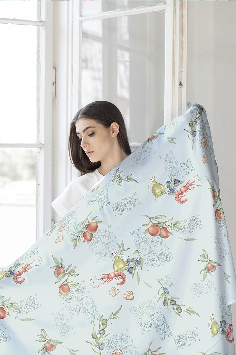 textile pattern design presented by a model next to the window in a sunny room